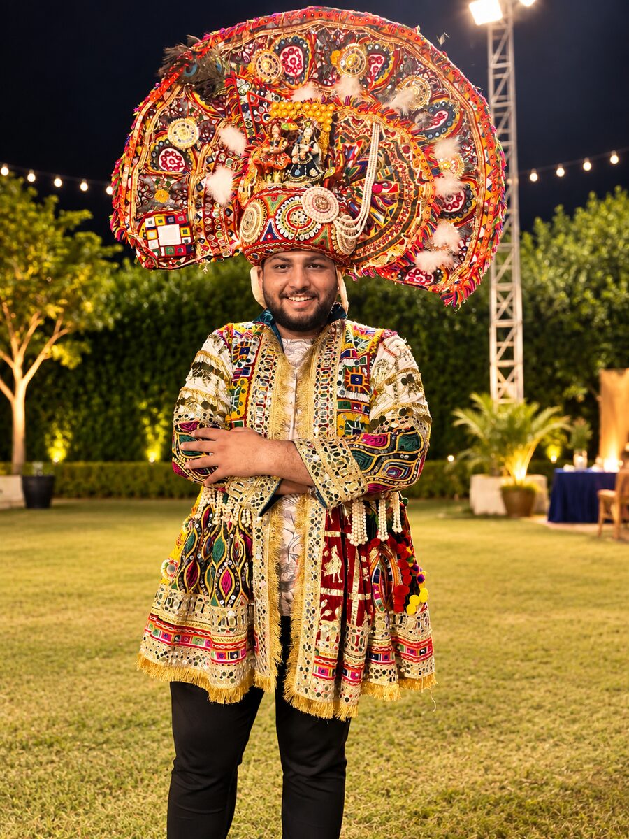Jainam Shah, founder of Haggler Studio, in an embroidered Kutchi jacket and a mirror-work turban at Garba
