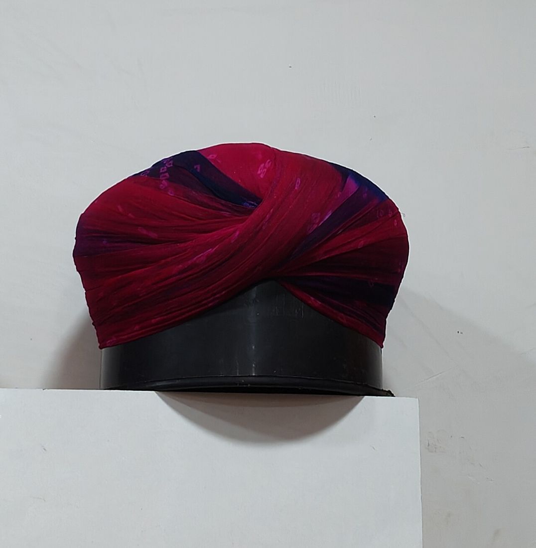Wrapped Rajasthani safa in red and purple tie-dye
